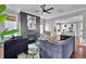 Stylish living room with a modern fireplace, hardwood floors, and an open concept design at 2876 Rivertowne Pkwy, Mount Pleasant, SC 29466