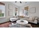 Bright living room featuring a large sectional couch, round coffee table, and stylish decor at 2876 Rivertowne Pkwy, Mount Pleasant, SC 29466