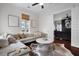Cozy living room with a large sectional sofa, a round coffee table, and access to another room at 2876 Rivertowne Pkwy, Mount Pleasant, SC 29466