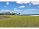 Beautiful coastal home with a private dock, set amidst tranquil marshlands for ultimate relaxation and waterfront enjoyment at 2876 Rivertowne Pkwy, Mount Pleasant, SC 29466