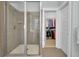Tiled shower enclosure with glass door leading to a walk-in closet at 2876 Rivertowne Pkwy, Mount Pleasant, SC 29466