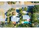Aerial view of a private backyard with a sparkling pool and lush greenery at 3 25Th Ave, Isle of Palms, SC 29451