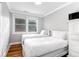 Neutral bedroom with two twin beds featuring crown molding detail at 3 25Th Ave, Isle of Palms, SC 29451