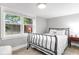 Bedroom with a full bed and large window overlooking the backyard at 3 25Th Ave, Isle of Palms, SC 29451