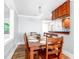 Cozy dining room featuring hardwood floors, a wood table, and natural light at 3 25Th Ave, Isle of Palms, SC 29451