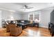 Comfortable living room with a large sectional sofa, hardwood floors, and stylish decor at 3 25Th Ave, Isle of Palms, SC 29451