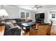 Comfortable living room with a large sectional sofa, hardwood floors, and stylish decor at 3 25Th Ave, Isle of Palms, SC 29451