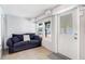 Comfortable sitting area with a blue sofa and door leading to the outside at 3 25Th Ave, Isle of Palms, SC 29451
