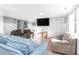 Cozy living room with a TV, patterned armchairs, and comfortable seating at 3 25Th Ave, Isle of Palms, SC 29451