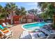Stunning backyard with a sparkling pool, a bar, and a large deck perfect for entertaining at 3 25Th Ave, Isle of Palms, SC 29451