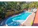A large inground backyard pool is surrounded by lounge chairs on a paved patio at 3 25Th Ave, Isle of Palms, SC 29451