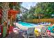 Beautiful backyard pool with lounge chairs and lush landscaping, perfect for relaxation at 3 25Th Ave, Isle of Palms, SC 29451