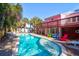 Gorgeous backyard pool with an attached jacuzzi and colorful patio furniture at 3 25Th Ave, Isle of Palms, SC 29451