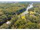Stunning aerial perspective of lush greenery, lakes, and a charming home at 4105 Gnarled Oaks Ln, Johns Island, SC 29455