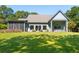 Expansive backyard with covered porch is perfect for outdoor living and entertaining at 4105 Gnarled Oaks Ln, Johns Island, SC 29455