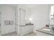 Bright bathroom featuring a vanity, sink, cabinet, tower cabinet, and a walk-in shower at 4105 Gnarled Oaks Ln, Johns Island, SC 29455