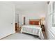 Cozy bedroom with a neutral color scheme, hardwood floors, and natural light from a nearby window at 4105 Gnarled Oaks Ln, Johns Island, SC 29455