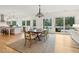 Elegant dining room showcasing stylish chandelier, dining set, and scenic outdoor views at 4105 Gnarled Oaks Ln, Johns Island, SC 29455