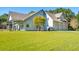 Spacious home with a well-manicured lawn and attached three car garage at 4105 Gnarled Oaks Ln, Johns Island, SC 29455