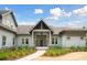 Beautiful home with a covered porch and a manicured yard with mature landscaping at 4105 Gnarled Oaks Ln, Johns Island, SC 29455