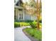 Inviting walkway to this home featuring manicured landscaping and a charming facade at 4105 Gnarled Oaks Ln, Johns Island, SC 29455