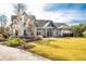 Charming home with a manicured lawn, inviting entryway and a well designed front yard at 4105 Gnarled Oaks Ln, Johns Island, SC 29455