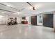 Spacious three car garage with epoxy flooring, wall organizers, and high ceilings at 4105 Gnarled Oaks Ln, Johns Island, SC 29455