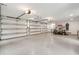Massive garage with multiple garage doors, high ceilings and finished flooring at 4105 Gnarled Oaks Ln, Johns Island, SC 29455