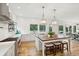 Well-lit kitchen features an island with seating and stainless steel appliances at 4105 Gnarled Oaks Ln, Johns Island, SC 29455