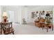 Well-lit living room featuring a built-in bookshelf, comfortable seating, and bright neutral colors at 4105 Gnarled Oaks Ln, Johns Island, SC 29455