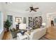 Cozy living room featuring built-in bookshelves, comfortable seating and natural lighting, perfect for relaxation and entertainment at 4105 Gnarled Oaks Ln, Johns Island, SC 29455