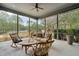 Inviting sunroom with views of the lake offers a peaceful retreat for relaxation and enjoyment at 4105 Gnarled Oaks Ln, Johns Island, SC 29455