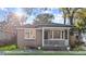 Charming brick home features a cozy porch and well-manicured landscaping at 47 Drake St, Charleston, SC 29403