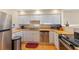 Cozy kitchen features white cabinets, stainless steel appliances, and butcher block countertops at 47 Drake St, Charleston, SC 29403