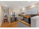 Modern kitchen featuring stainless steel appliances, butcher block countertops, and white cabinetry at 47 Drake St, Charleston, SC 29403