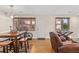 Cozy living area featuring hardwood floors, a dining table, and a comfortable chair near the door at 47 Drake St, Charleston, SC 29403