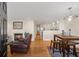 Inviting living room with a fireplace, dining table, and open kitchen with modern appliances at 47 Drake St, Charleston, SC 29403