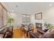 Inviting living room with a fireplace, a floral sofa, and hardwood floors, creating a cozy atmosphere at 47 Drake St, Charleston, SC 29403