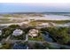 Expansive aerial view showcases home's waterfront location, pond, and neighborhood at 4935 Sound View Dr, Mount Pleasant, SC 29466