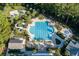 Aerial view of a community pool with water slide, seating, and lush landscaping at 4935 Sound View Dr, Mount Pleasant, SC 29466