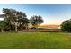 Lush backyard with green lawn and views of the serene marsh at 4935 Sound View Dr, Mount Pleasant, SC 29466