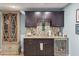Wet bar features custom cabinetry, backsplash, countertop, and beverage cooler at 4935 Sound View Dr, Mount Pleasant, SC 29466