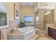 This bathroom has a jacuzzi tub, large window, and a tiled walk-in shower at 4935 Sound View Dr, Mount Pleasant, SC 29466