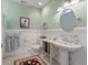 Charming bathroom featuring elegant pedestal sink, and custom details at 4935 Sound View Dr, Mount Pleasant, SC 29466