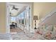 View from bedroom to balcony with scenic views, complemented by a stylish headboard and bedside table at 4935 Sound View Dr, Mount Pleasant, SC 29466