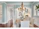 Elegant dining room featuring hardwood floors, chandelier, and open floor plan to the living room at 4935 Sound View Dr, Mount Pleasant, SC 29466