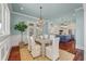 Beautiful dining room with hardwood floors, a chandelier, and an open view to the kitchen at 4935 Sound View Dr, Mount Pleasant, SC 29466