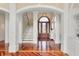 Inviting entryway boasts beautiful hardwood floors and a front door with decorative glass at 4935 Sound View Dr, Mount Pleasant, SC 29466