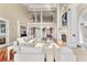 Grand foyer with hardwood floors, a staircase, and a decorative front door, creating an inviting entrance at 4935 Sound View Dr, Mount Pleasant, SC 29466