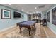 Spacious game room with pool table, wet bar, tv, and custom chalk board at 4935 Sound View Dr, Mount Pleasant, SC 29466
